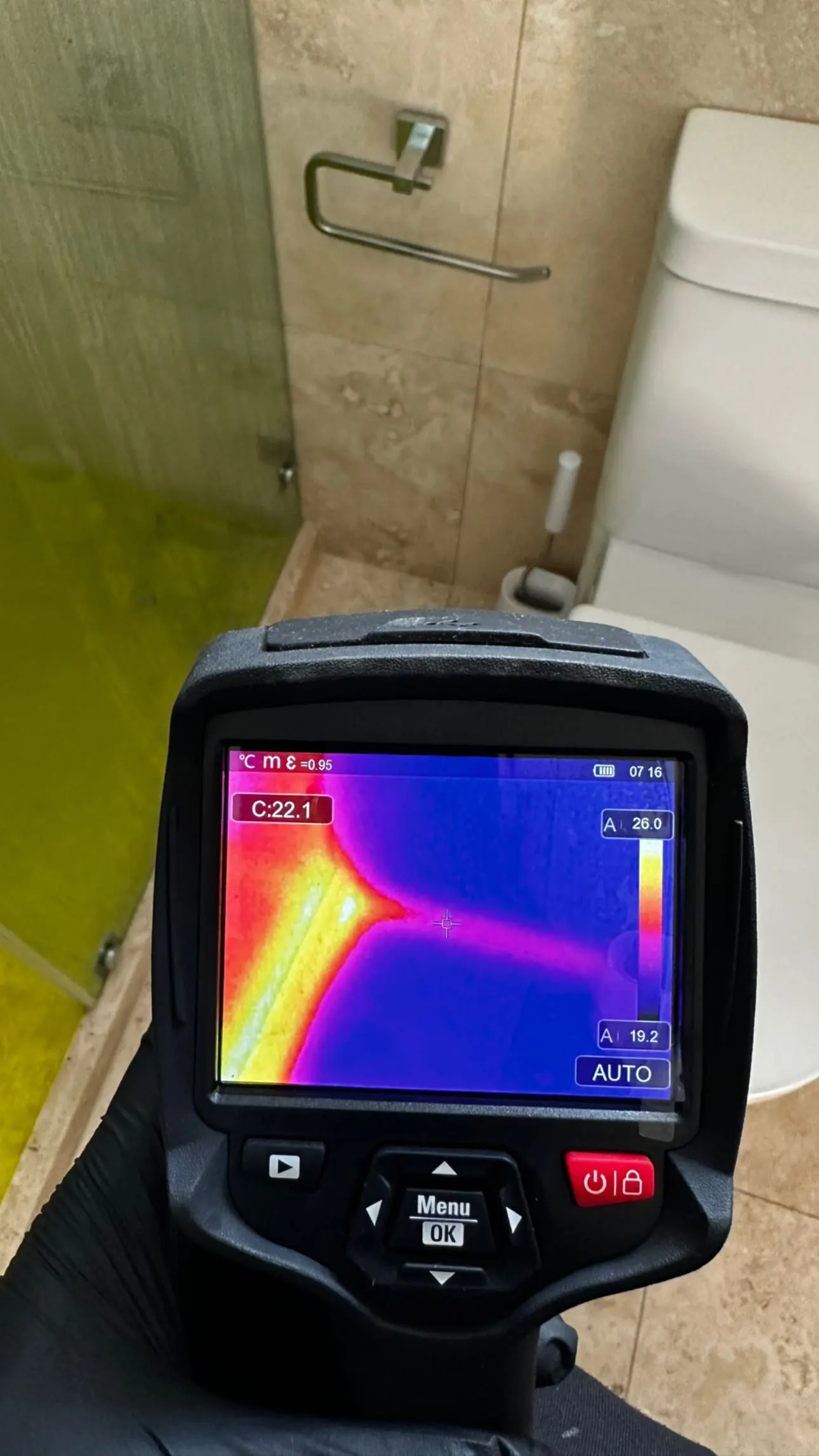 OPS thermal imaging camera detecting hidden leak behind a bathroom wall